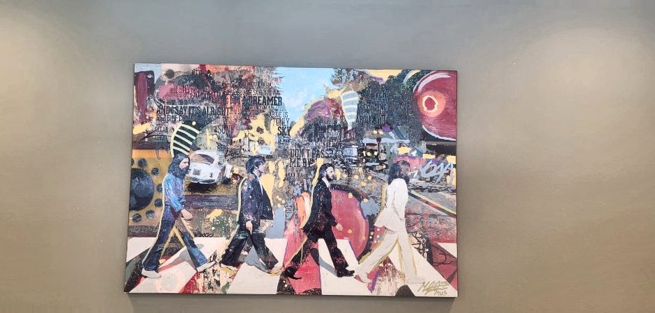 Large canvas art hung securely on a wall