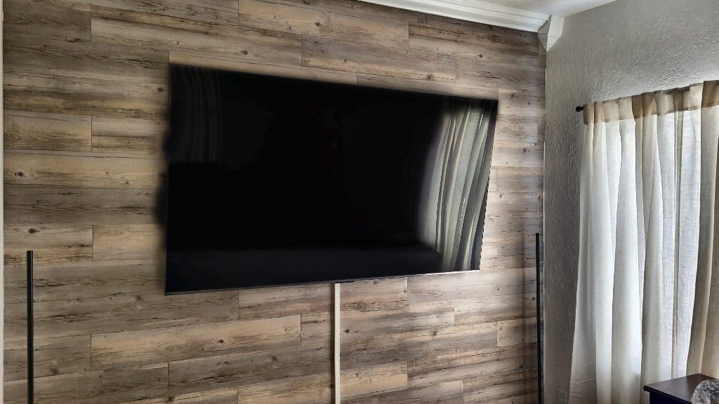 TV mounted on a wood accent wall